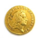 A George I gold quarter guinea, dated 1718.