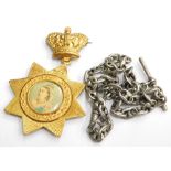 Two items of jewellery, comprising a Coronation souvenir medal and a watch chain, with rubbed markin