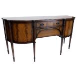 A mahogany and ebony strung sideboard in regency style, the cross banded top with a reeded edge, abo