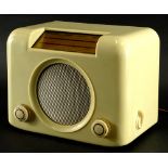 A vintage cream coloured Bakelite Bush radio, type DAC90A in fitted case with circular speaker and t
