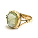 A 9ct gold cameo set dress ring, with oval cameo depicting a gentleman looking left, with V splayed