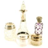 A collection of cut glass, etc., mounted in silver, to include an amethyst tinted scent bottle with