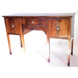 A mahogany and ebony strung sideboard in George III style, with a frieze drawer, flanked by two door