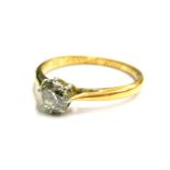 An 18ct gold and platinum diamond solitaire ring, set with an old cut diamond 5.4mm x 5.4mm x 3.8mm,