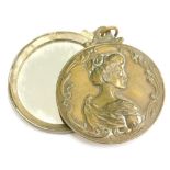 An Art Nouveau design brass pendant, with figure of a lady looking right, and bearing inscription fo