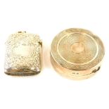 A George V circular silver pill box, with engraved lid, gilt interior, Birmingham 1927 and a silver