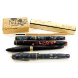 A Sheaffer's fountain pen in black with gilt and chrome trim, 13cm wide, a Summit, red and black mar
