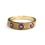 A Victorian 9ct gold dress ring, set with four rubies and three illusion set diamonds, ring size J,