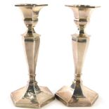 A pair of George V silver candlesticks, of octagonal form, Birmingham 1932, loaded, 17.5cm high.