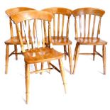 A set of four late 20thC lathe back kitchen chairs.