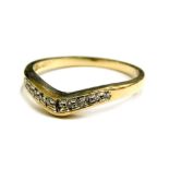 A 9ct gold dress ring, of wishbone design, set with tiny diamonds in platinum setting, ring size K,