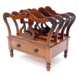 An early Victorian mahogany Canterbury, with three divisions each on lyre shaped supports, with a fr