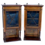 A pair of late 19thC rosewood and marquetry wall cabinets, each with a frieze decorated with swags e