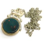 A silver lion headed swivel agate fob, set with green and orange agate, with lion to top, on a silve