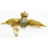 A 9ct gold RAF wings brooch, with red and green enamel design, with safety chain, 5cm wide, 5.1g all