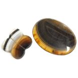 Two loose agate pieces, comprising an oval brown design brooch insert, and a three point clover, wit