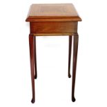 An early 20thC mahogany and parquetry urn table, the square top with a moulded edge, on turned taper