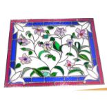 A 20thC lead glass panel, of rectangular form, polychrome decorated with various floral sections, wi