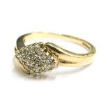 A 9ct gold dress ring, with central diamond shaped multi-stone diamond centre, and two split shoulde