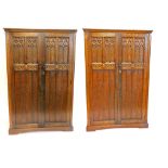 An oak carved wardrobe, decorated in the Gothic style with roundels, reeds, etc., 180cm high, 121cm