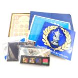 Various commemorative coins, stamps and medallions, to include ESSO football, etc.