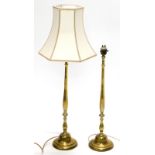 A pair of brass table lamps, each on slender baluster stems, terminating in bell shaped feet, 55cm h