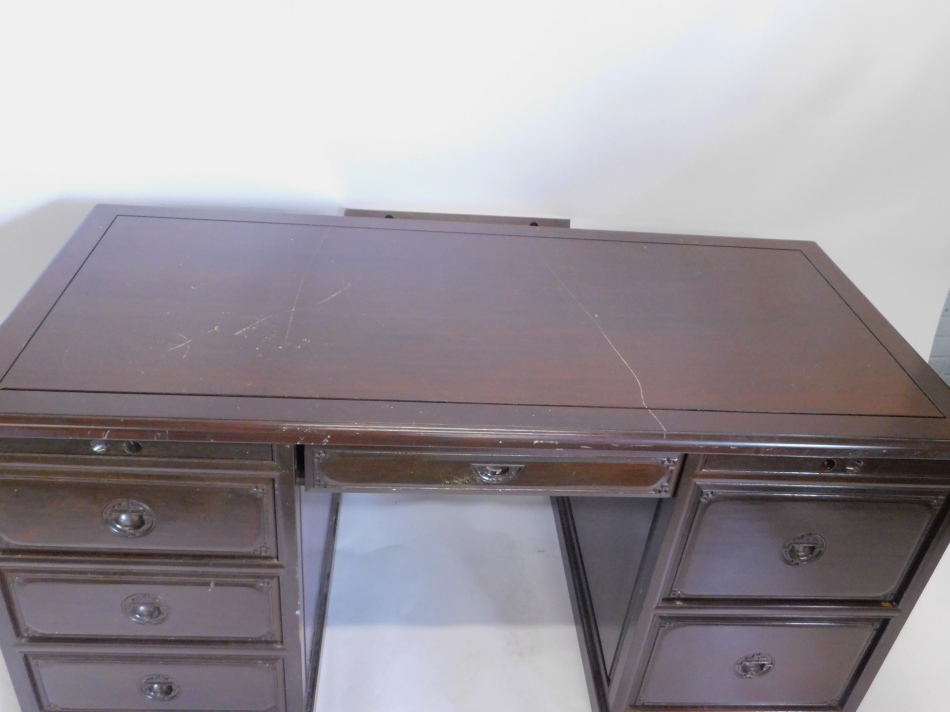 An oriental hardwood kneehole desk, with an arrangement of drawers and slides etc, on a plinth base, - Image 2 of 2