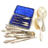 A collection of silver mounted dressing table items, to include two brushes, shoe horns, button hook
