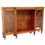 An early 20thC walnut astragal bookcase, with a pair of glazed doors, flanking another pair of glaze