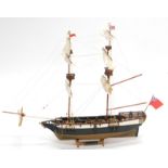 A wooden model of a warship The Galleon Portsmouth, with realistic decking and masts, set with canno