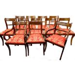 A harlequin set of twelve mahogany dining chairs, each with a rope twist back, a drop in seat uphols