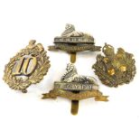 Various cap badges, comprising the Lincolnshire Regiment 1881 to 1948, 6cm high, and earlier 10th No