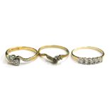 Three dress rings, comprising a 18ct gold and platinum art deco style twist ring, each set with two