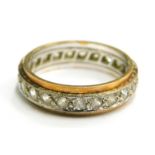 A 9ct gold eternity ring, set with CZ stones in a white metal setting, with gold coloured outer band