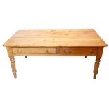 A Victorian stripped pine dairy type table, the rectangular top with rounded corners above two friez