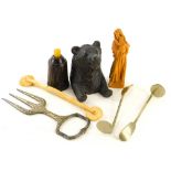 Bygones and collectables, an early 20thC Black Forest bear, thimble box, the carved beast seated, 9c