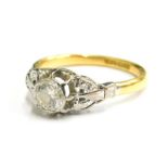 An 18ct gold and platinum diamond solitaire ring, set with single round brilliant cut diamond, in ru