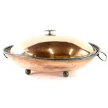 An oval copper pan or kettle, with two handles on bun feet, 43cm wide.