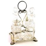 A late Victorian four piece silver and cut glass cruet, with rectangular base with a beaded border o