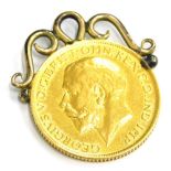 A George V full gold sovereign pendant, dated 1913, with a 9ct gold, three point twist frame, 9g all