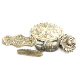 Five brooches, comprising a silver pistol brooch, a silver memorial backed souvenir brooch, a silver