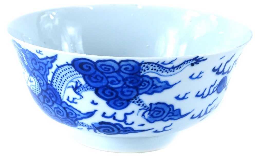 A Chinese porcelain bowl, decorated with dragons in blue, etc., four character mark to underside, (A