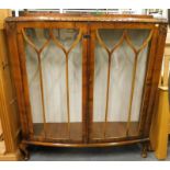 A 1930s glazed front display cabinet.