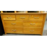 An oak chest of three short and four long drawers.