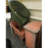 A collection of Lloyd Loom style furniture, to include two tub chairs, and a side table.