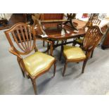 A mahogany twin pedestal dining table, and set of six Swannacks of Retford dining chairs. The uphols