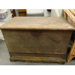 A 19thC brown painted pine mule chest, the hinged lid enclosing a section for candles, above a friez