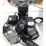 A Canon EOS 400D digital camera, a Tamron for Canon lens, etc.