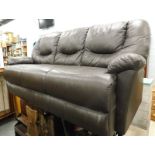 A brown leather three seater sofa. The upholstery in this lot does not comply with the 1988 (Fire &