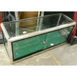 A glass table top display cabinet.